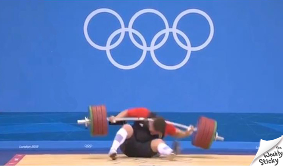 Man dropping weight on his head at the Olympics
